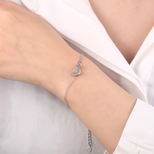 Serpentine - bracciale con moissanite e motivo a infinito, con gemme incastonate a pavé